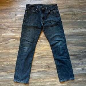 Men’s Levi’s 513. Broken in and faded. Darker denim.
